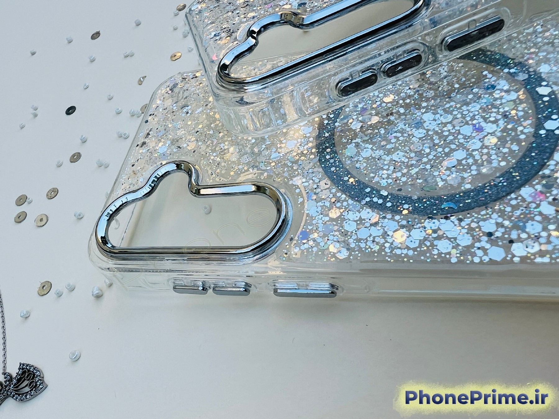 قاب شفاف اکلیلی شاین نقره‌ای با مگ‌سیف و پولک‌های براق مخصوص Samsung A35 – محافظ لنز نقره‌ای