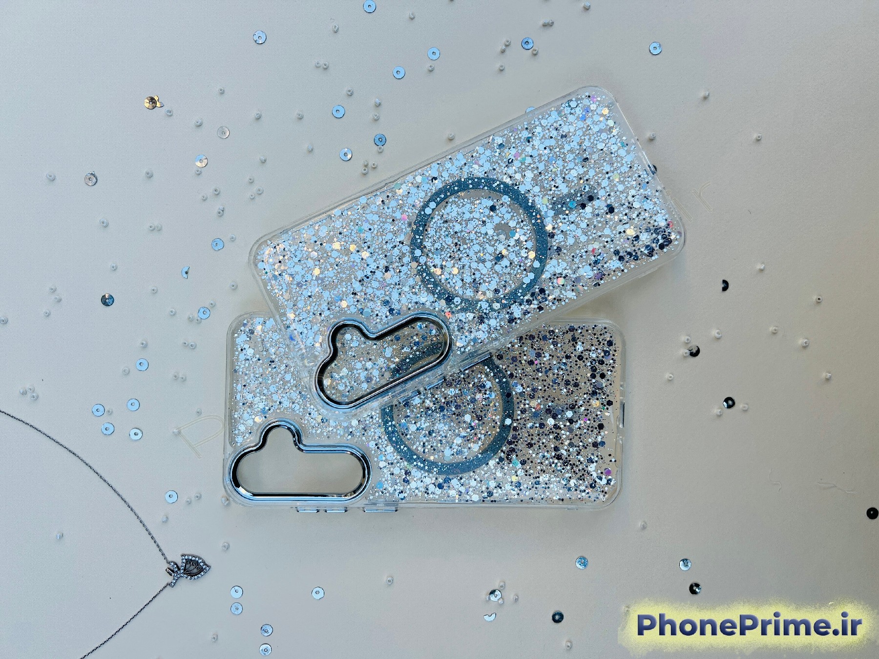 قاب شفاف اکلیلی شاین نقره‌ای با مگ‌سیف و پولک‌های براق مخصوص Samsung A35 – محافظ لنز نقره‌ای