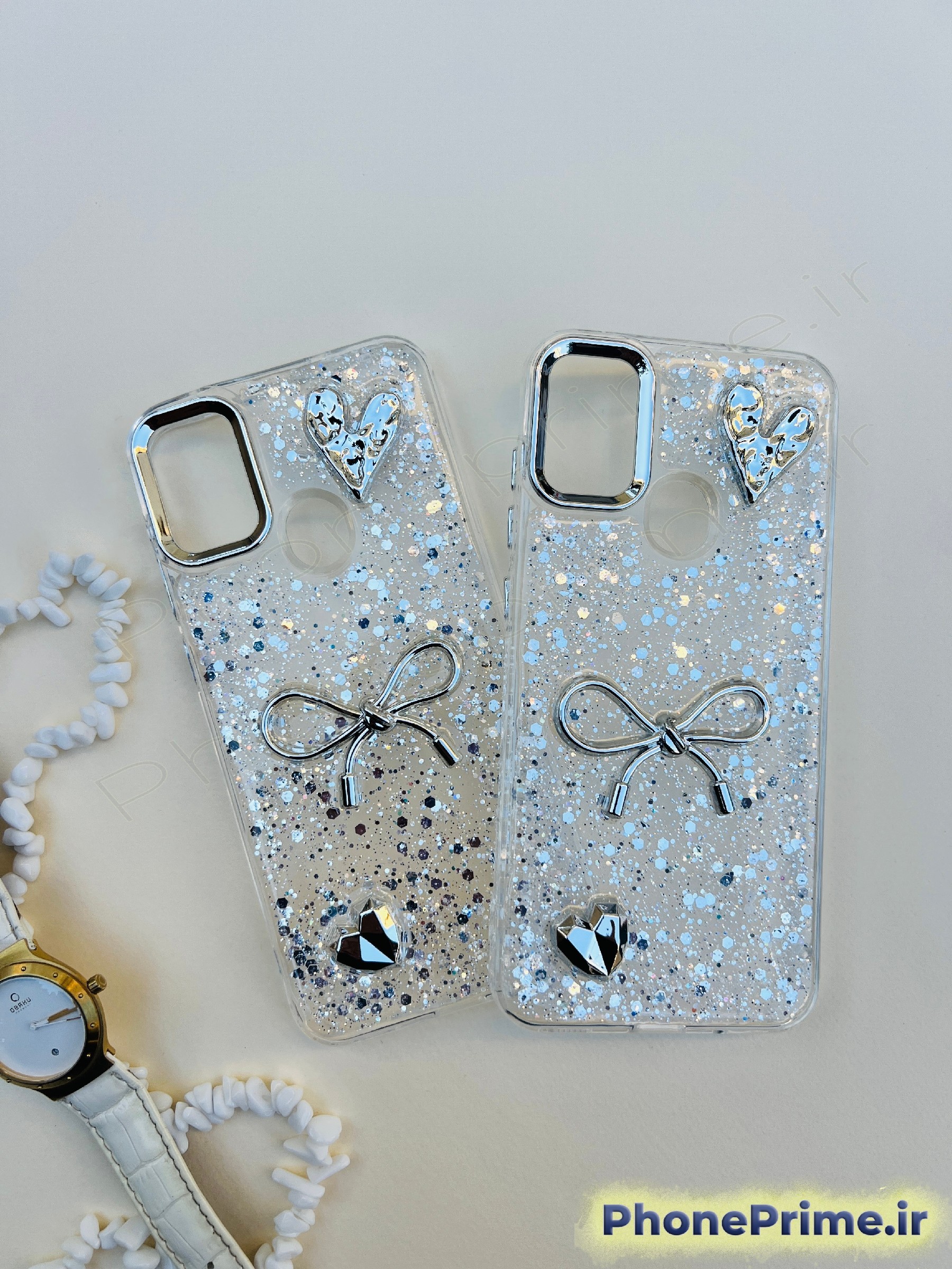 کاور شفاف اکلیلی شاین نقره‌ای سامسونگ A11 همراه با پاپیون و قلب شاین