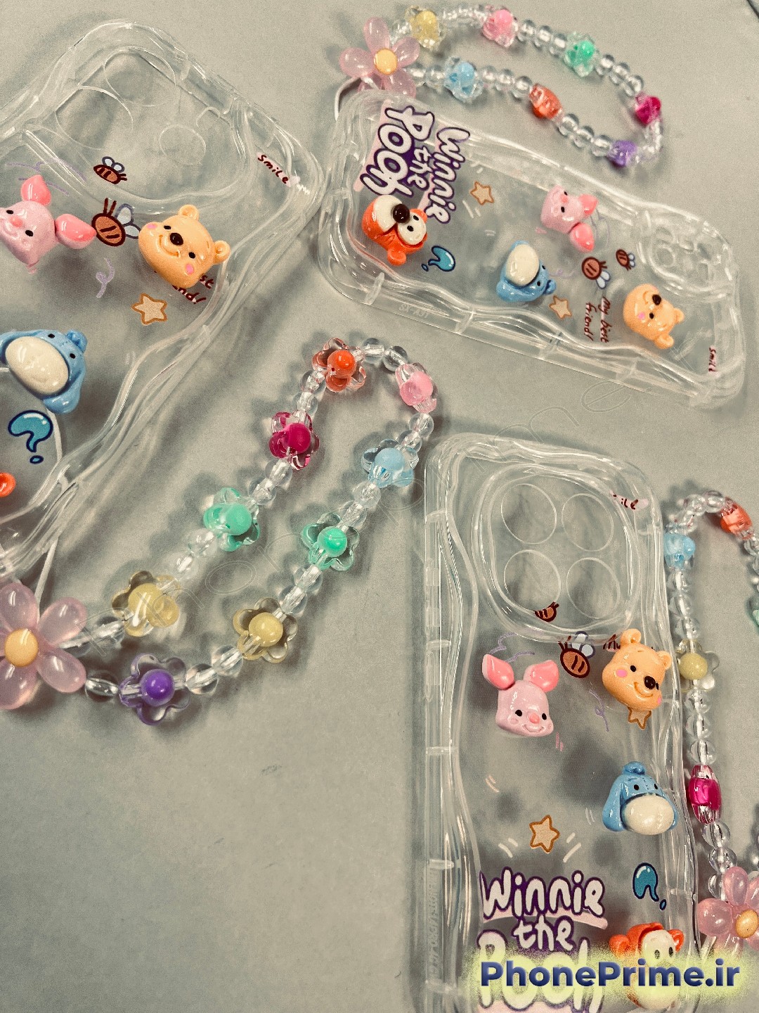 قاب گوشی سامسونگ A07 فانتزی طرح وینی پو عروسکی برجسته با بند آویز مهره ای و لبه موج دار